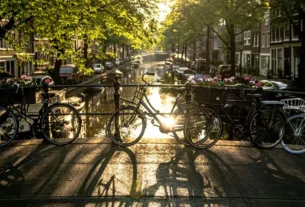 bicycles on a bridge over a canal