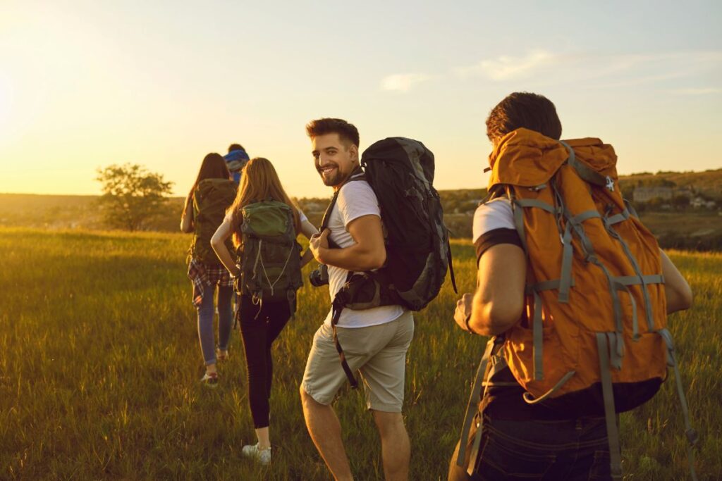 a group of people hiking in a field